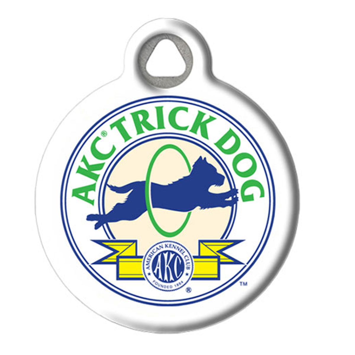 A round white pet ID tag with a hanging loop at the top, featuring the AKC Trick Dog logo in green, blue, and yellow on a white background.
