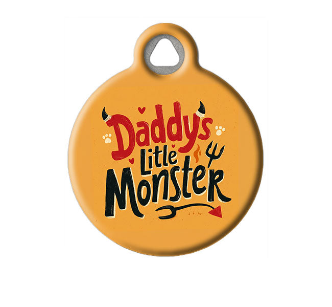 Round orange pet tag with 'Daddy's Little Monster' text on a white background