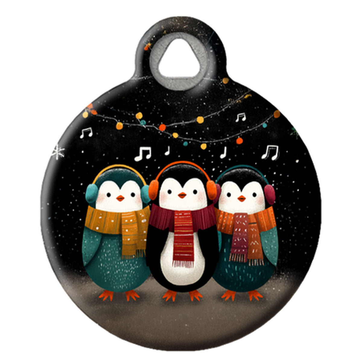 Round keychain with penguins wearing scarves and headphones against a snowy background.
