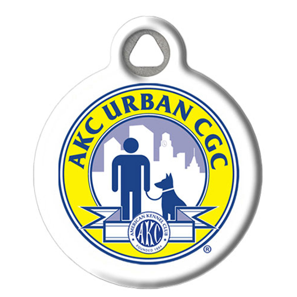 A round white plastic pet ID tag with a hanging loop at the top, featuring the AKC URBAN CGC logo in blue and yellow on a white background.